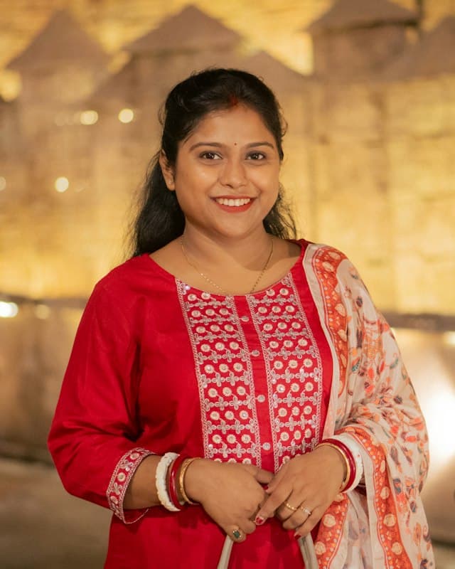 A smiling woman in a red outfit